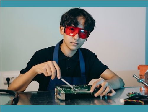 Teen working with electronics